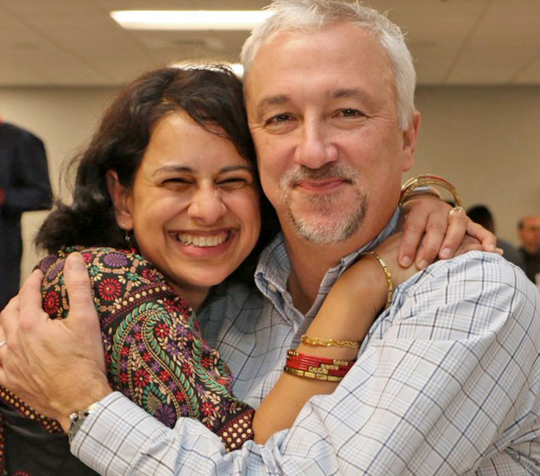 man and woman hugging