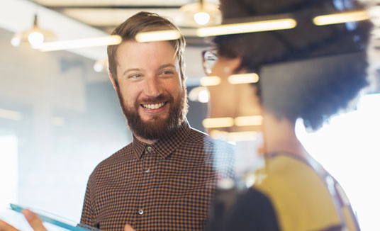 Woman and man talking for Nuance Contact Centre AI