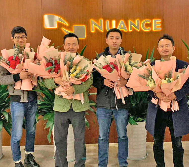 four men with flower bouquets